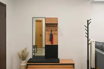 a view from the hallway into a living room with a red umbrella at Luxury Apartment for 5 Ppl in the Center of Athens in Athens