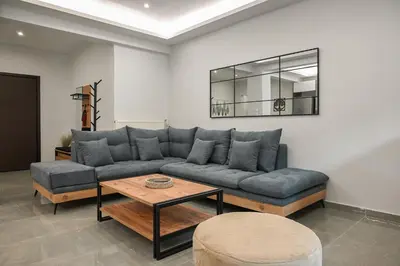 a living room with a couch and a table at Luxury Apartment for 5 Ppl in the Center of Athens in Athens