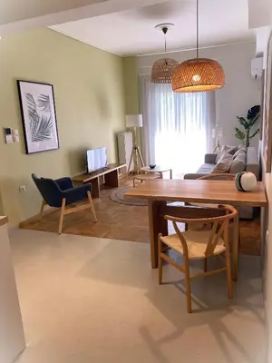 a living room with a table and a couch at Acropolis Central Living in Athens