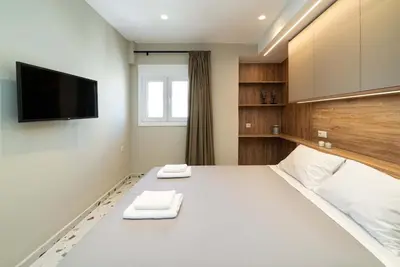 a room with a bed with two towels on it at Casa Arcobaleno Athens in Athens