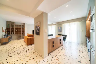 a large room with a kitchen and a living room at Casa Arcobaleno Athens in Athens