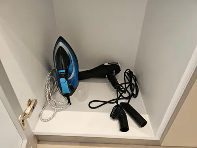 a hairdryer and other items on a wall at OLYMPIC Perfect Base to Explore Athens, Central Penthouse near metro and train in Athens