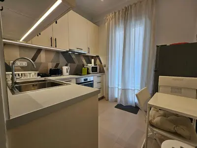 a kitchen with a sink and a counter top at OLYMPIC Perfect Base to Explore Athens, Central Penthouse near metro and train in Athens