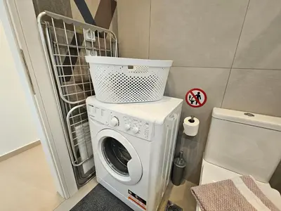 a washer and dryer in a small room at OLYMPIC Perfect Base to Explore Athens, Central Penthouse near metro and train in Athens