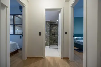 a hallway with a door leading to a bedroom at Ilisia Home in Athens