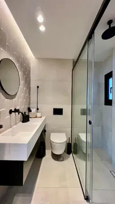 a bathroom with a toilet and a sink and a shower at The First by 22 in Piraeus