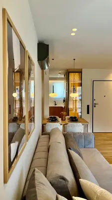 a living room with a couch and a table at The First by 22 in Piraeus