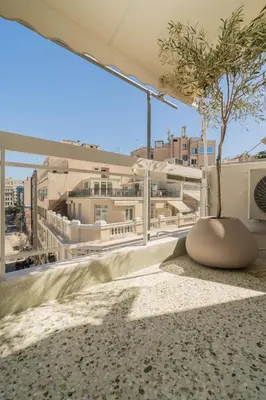 a tree on the roof of a building at Elegant Suite Syntagma A2 in Athens