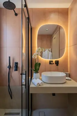 a bathroom with a sink and a mirror at Elegant Suite Syntagma A2 in Athens