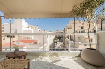 a balcony with a table and a view of a city at Elegant Suite Syntagma A2 in Athens