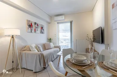 a living room with a couch and a table at Suite Escape - Cozy House in Egaleo-Athens in Athens