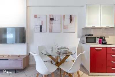 a kitchen with a table and chairs in a kitchen at Suite Escape - Cozy House in Egaleo-Athens in Athens