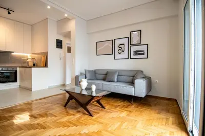 a living room with a couch and a table at Olympian Zeus top location in Athens