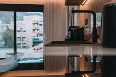 a kitchen with a counter top and a window at Elegant Penthouse 2 BRs - Large Veranda with View in Athens
