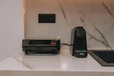 a toaster sitting on a counter next to a toaster at Elegant Penthouse 2 BRs - Large Veranda with View in Athens