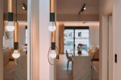 a group of lights hanging from a wall in a room at Elegant Penthouse 2 BRs - Large Veranda with View in Athens