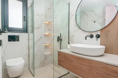 a bathroom with a sink and a mirror at Elegant Penthouse 2 BRs - Large Veranda with View in Athens