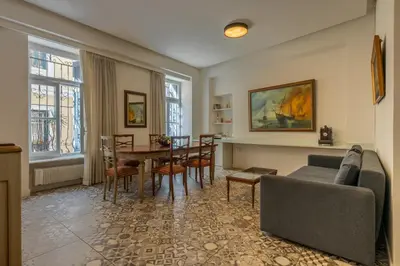 a living room with a couch and a table at The Acropolis Mansion in Athens