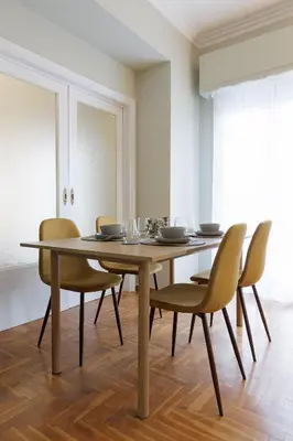 a dining room with a table and chairs at Athens Koukaki Penthouse, Acropolis view in Athens