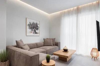 a living room with a couch and a table at Athens Luxury Ethereal Stay in Athens