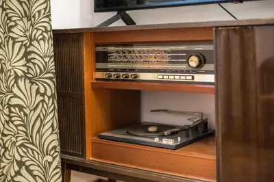 a cabinet with a radio and a cd in it at Stylish Luxury Apartment at Ampelokipi metro station in Athens