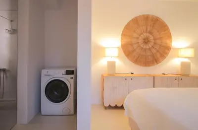 a room with a bed and a washing machine at Bunny Island Exquisite Villas in Lagonissi
