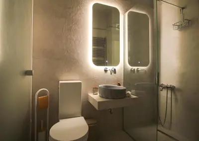 a bathroom with a sink and a toilet and a shower at Bunny Island Exquisite Villas in Lagonissi
