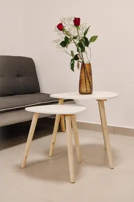 a table with a vase of flowers on top of it at La Stella Apartment Thisio in Athens