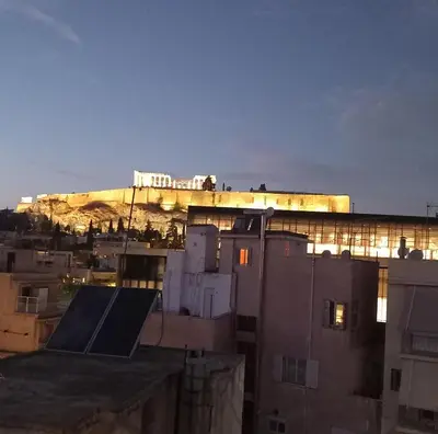 a view of the acropolis from the roofs of buildings at Super central loft - Acropolis metro, museum in Athens