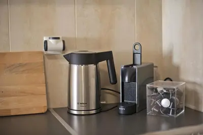 a coffee maker sitting on top of a counter at Oasis Neos Kosmos Modern Apt near Acropolis in Athens