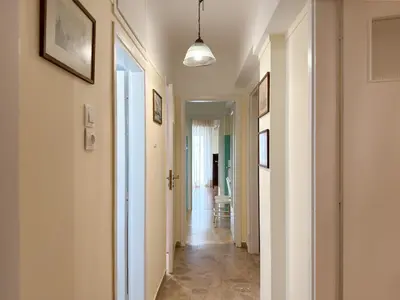 a hallway with white walls and a hallway with a hallway at Athina in Athens 5 min to Metro Station in Athens