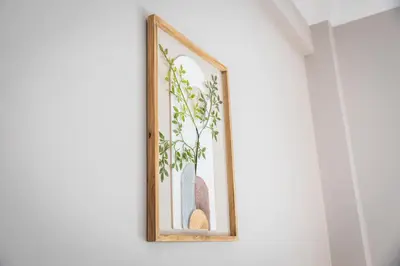a framed picture of a plant on a wall at 3BD Family Comfort Stay in Athens