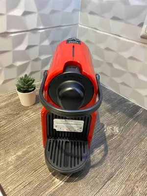 a red blender sitting on top of a table at Kallithea metro station in Athens
