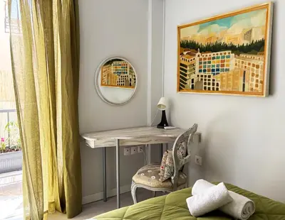 a bedroom with a desk and a mirror and a bed at Arthome Acropolis Spot in Athens