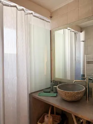 a bathroom with a sink and a mirror at Arthome Acropolis Spot in Athens