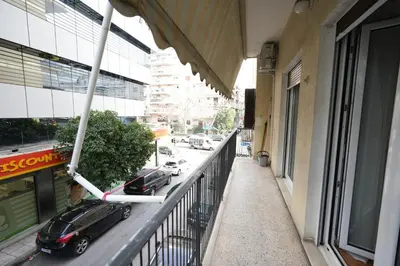 a balcony with a car parked on the side of a building at Ilysia's Retreat, Cozy 1 BDRM Apartment in Athens