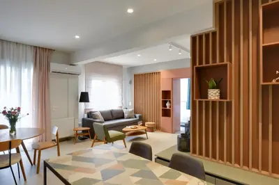 a living room with a couch and a table at The Athens Urban Loft in Athens