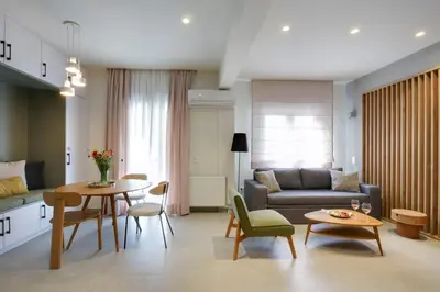 a living room with a couch and a table at The Athens Urban Loft in Athens