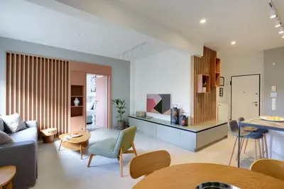 a living room with a couch and a table at The Athens Urban Loft in Athens