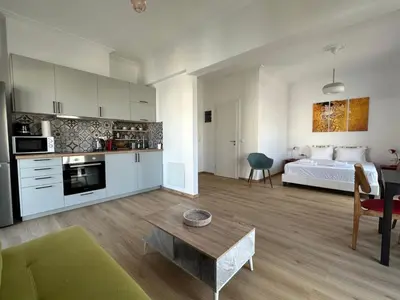 a large living room with a bed and a kitchen at 6th Floor Skyline Suite with Spectacular View in Athens