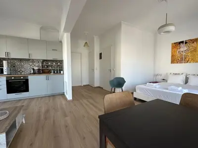 a living room with a bed and a kitchen at 6th Floor Skyline View Studio 1 in Athens in Athens