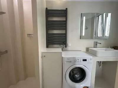 a bathroom with a washing machine and a sink at 6th Floor Skyline View Studio 2 in Athens in Athens