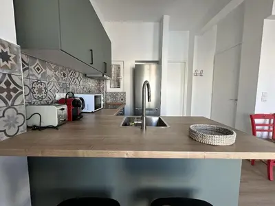 a kitchen with a wooden counter top with a sink at 6th Floor Skyline View Studio 2 in Athens in Athens