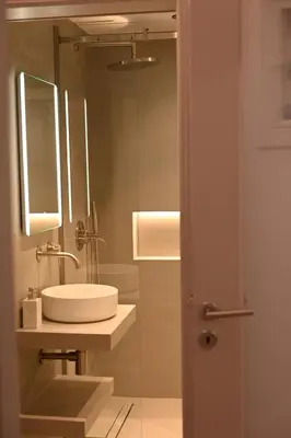 a bathroom with a sink and a mirror at Brand new 3bedroom athenian flat in Koukaki in Athens