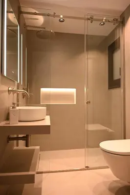 a bathroom with a glass shower and a sink at Brand new 3bedroom athenian flat in Koukaki in Athens