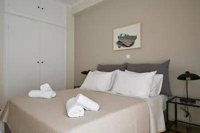 a bedroom with a bed with towels on it at Pristine 3 bedroom Luxury Sanctuary! in Athens