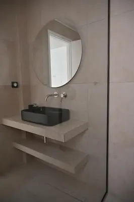 a bathroom with a sink and a mirror at Pristine 3 bedroom Luxury Sanctuary! in Athens