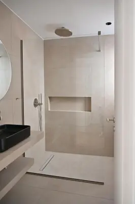 a bathroom with a glass shower with a sink at Pristine 3 bedroom Luxury Sanctuary! in Athens