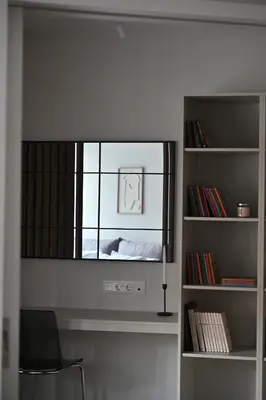 a room with a mirror and a book shelf at Luxury Sanctuary- Amazing Sea View - Beach Access in Athens