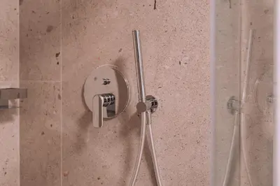 a shower in a bathroom with a glass door at Elegant Intimate Studio in Piraeus near Pasalimani in Piraeus